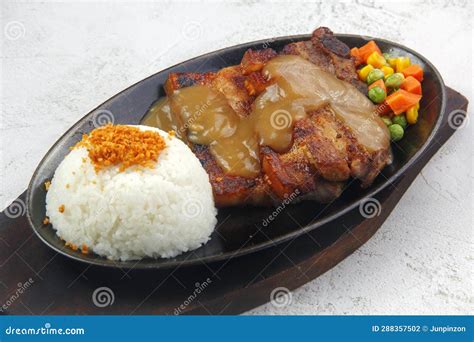 sizzling porkchop with rice|Sizzling Porkchop in Mushroom Gravy .